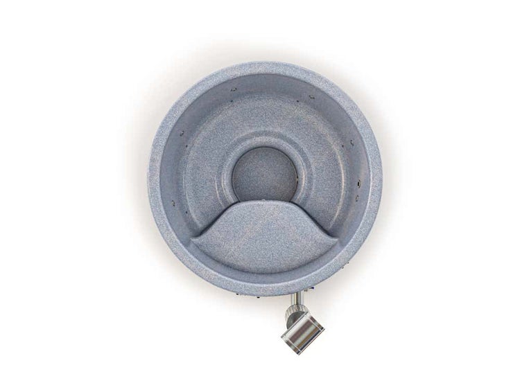 Runder Badezuber in Steinoptik mit integrierter Sitzbank und Düsen, Draufsicht.