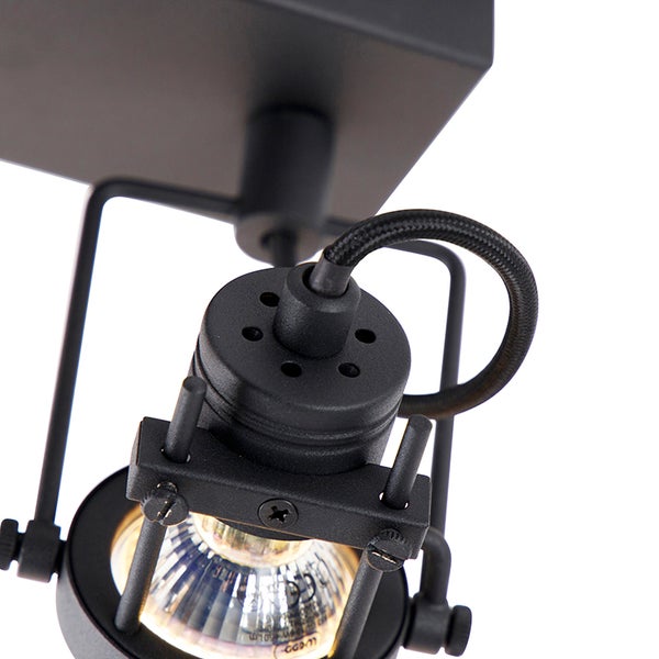 Detailaufnahme einer schwarzen Deckenleuchte mit Halogenlampe