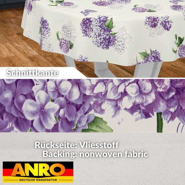 Runde Tischdecke mit Hortensien- und Schmetterlingsmuster, Detailansicht der Schnittkante und Rückseite aus Vliesstoff, ANRO Logo.