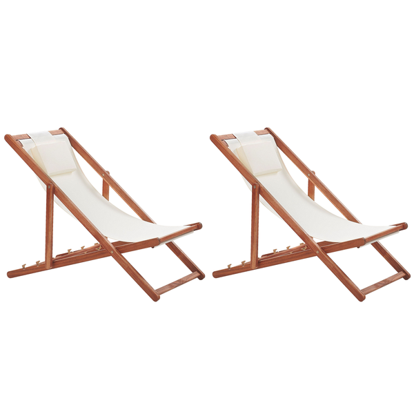 Zwei Holzliegen mit Kopfkissen