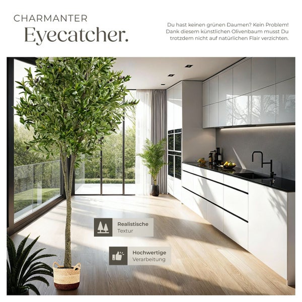Künstlicher Olivenbaum in einem hellen Raum mit moderner Küche.