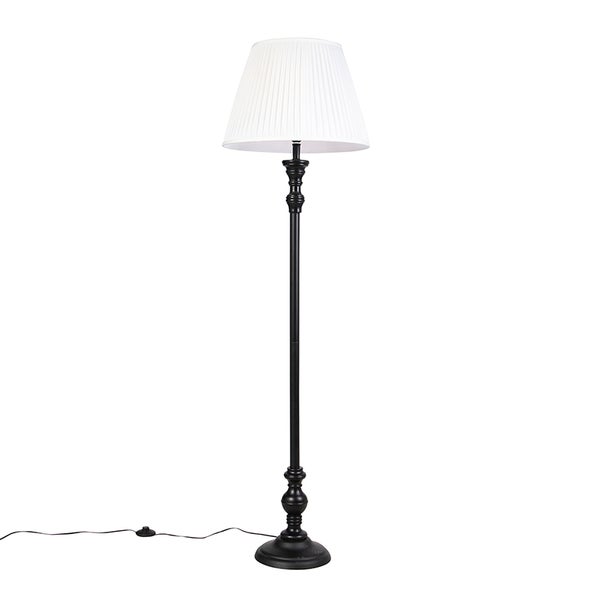Klassische Stehleuchte mit weißem plissiertem Stoffschirm, schwarzem Metallgestell und rundem Fuß.