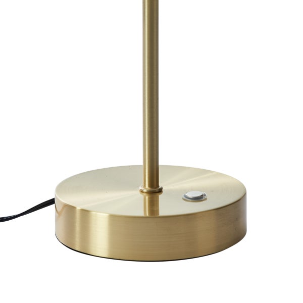 Runder Lampenfuß aus goldfarbenem Metall mit integriertem Tastschalter und einem schmalen Ständer.