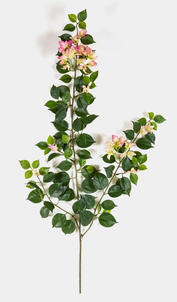 Künstlicher Zweig mit grünen Blättern und pinken Blüten für die Innendekoration.