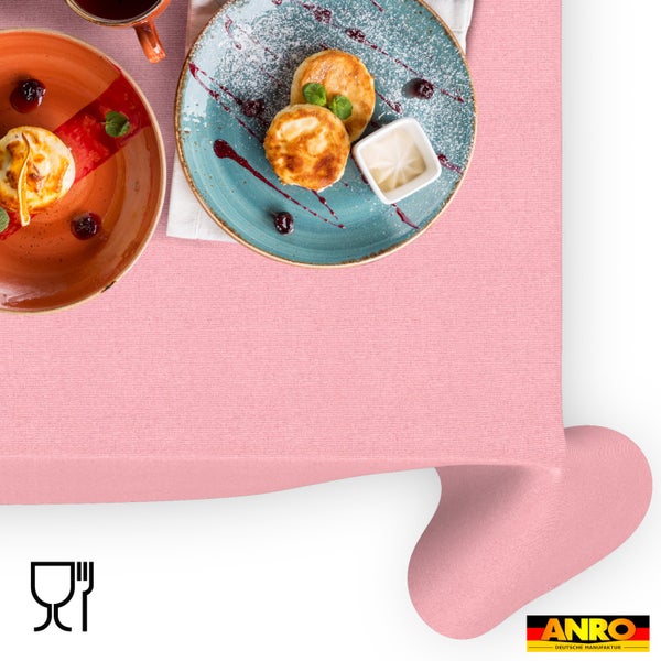 Strukturierte abwischbare Tischdecke mit Frühstücksgeschirr, Symbol für Lebensmittelechtheit und ANRO Logo.