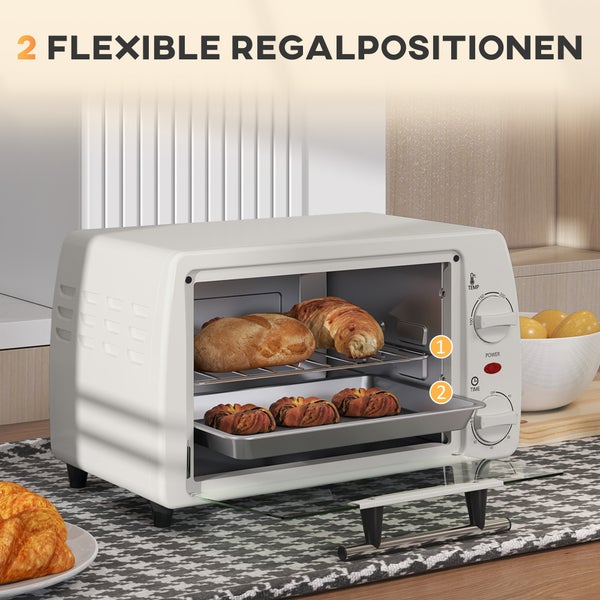 Mini-Backofen mit zwei flexiblen Einschubebenen für Backblech und Rost, befüllt mit Brot und Gebäck.