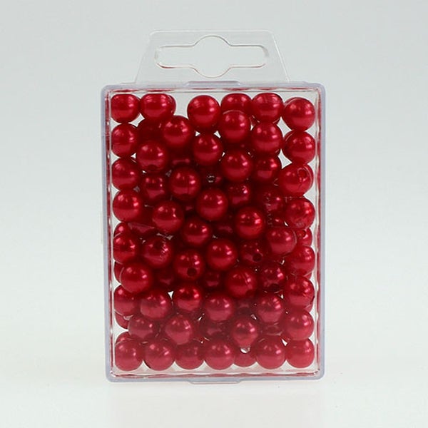 Packung rote Schmuckperlen
