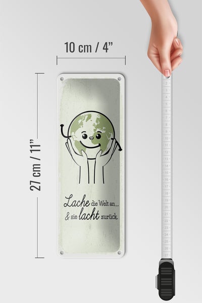 Blechschild Spruch Lache die Welt an sie lacht zurück 10x27cm