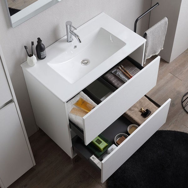 Moderner weißer Waschtisch mit zwei geöffneten Schubladen, integriertem Waschbecken und verchromter Armatur.
