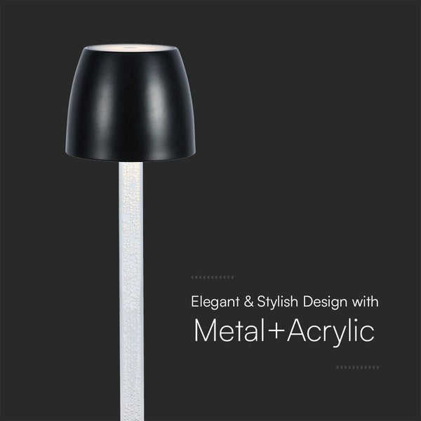 Dekorative Tischleuchte aus Metall und Acryl.