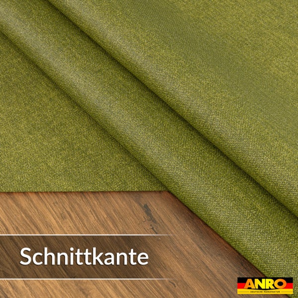 Strukturierter Stoff mit Schnittkante auf einer Holzoberfläche. ANRO Logo.