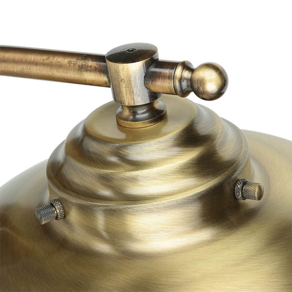 Detailansicht einer goldenen Lampe mit verstellbarem Arm