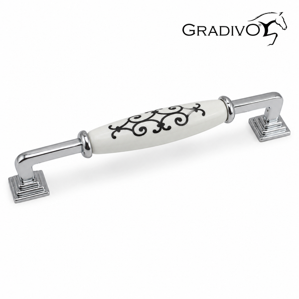 Möbelgriff aus verchromtem Metall mit weißem Keramikelement und schwarzem Ornament-Dekor, Gradivo Logo.