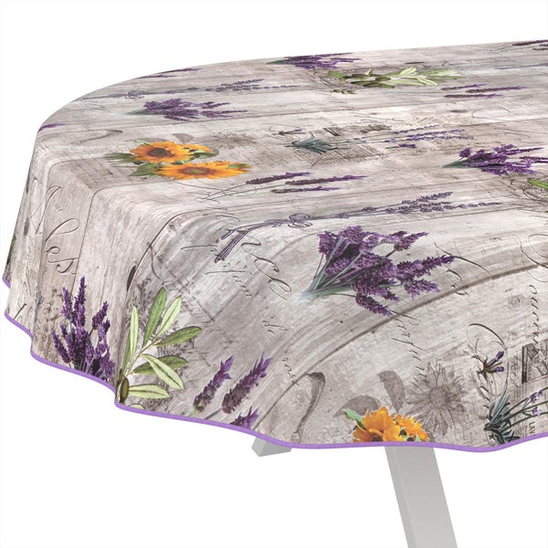 Ovale Tischdecke mit Holzoptik, Lavendel, Sonnenblumen und Olivenzweigen sowie einer lila Paspelierung.