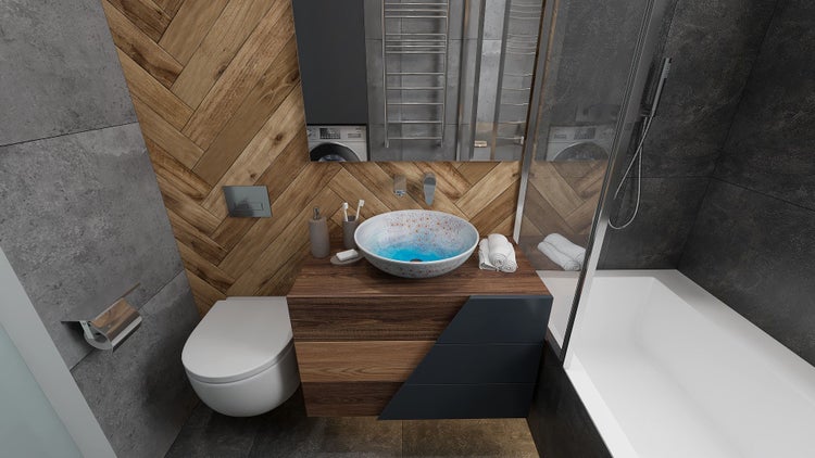 Badezimmer mit Waschbecken, Toilette und Badewanne