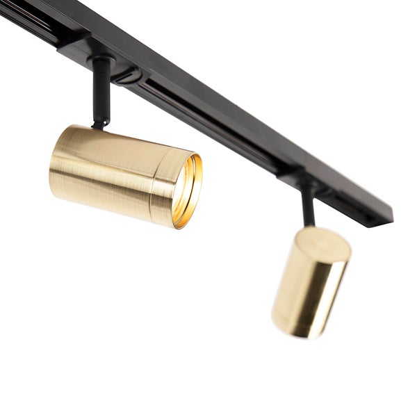 Schienensystem mit zwei zylindrischen Spots in Messing-Optik an einer schwarzen Schiene