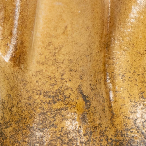 Nahaufnahme einer strukturierten, glasierten Keramikoberfläche