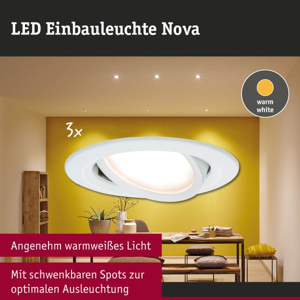 Dreier-Set weiße LED-Einbauleuchten Nova, rund, schwenkbar, für warmweißes Licht, montiert in einer modernen Decke über einem Esstisch.