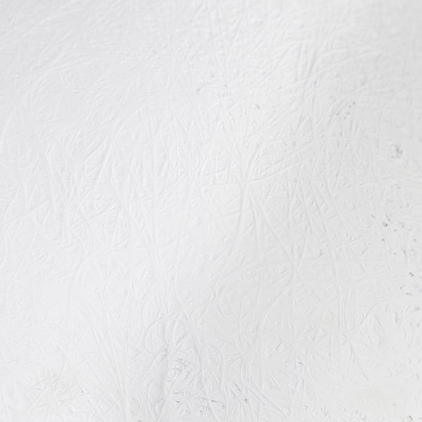 Detailaufnahme einer Oberfläche mit Spuren