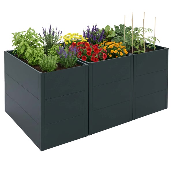 Modulares Hochbeet aus Metall in Anthrazit, bepflanzt mit Kräutern, Blumen und Tomatenpflanzen.
