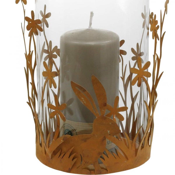 Dekorative Glaslaterne mit Hasen- und Blumenmuster und einer Kerze