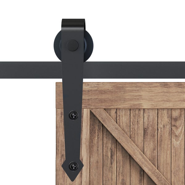 Schiebetürbeschlag aus schwarzem Metall mit Rolle, montiert an einer Stalltür aus Holz.