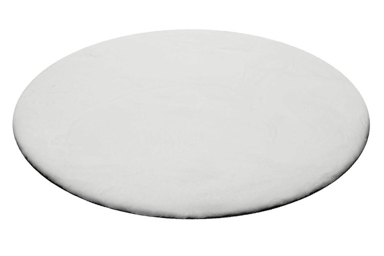 Runder weißer Teppich in Felloptik.