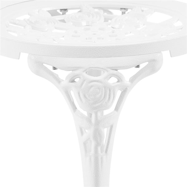 Detailansicht eines weißen Gartentisches aus Metall mit floralem Muster