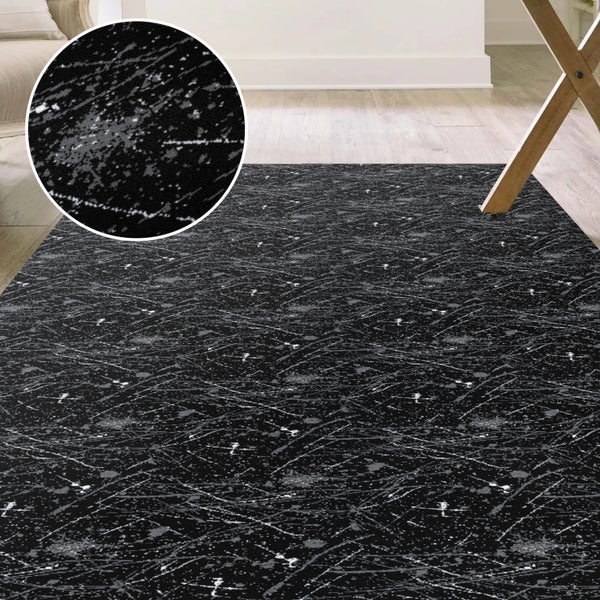 Teppich mit abstraktem Muster in Schwarz und Grau
