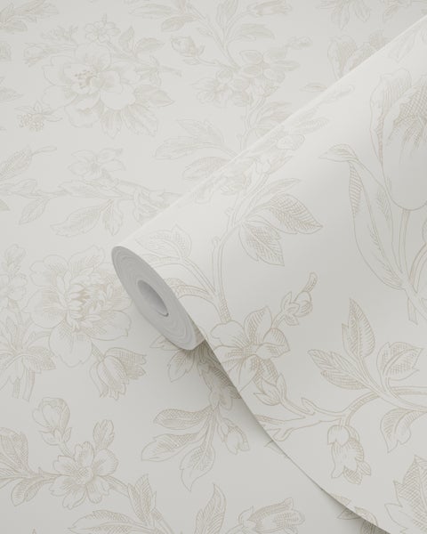 Vliestapetenrolle mit floralem Muster aus Blüten und Blattranken.