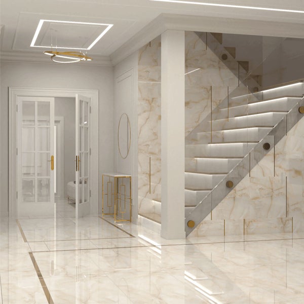 Elegantes Interieur mit Treppe, Marmorfliesen und indirekter Beleuchtung für ein helles, geräumiges Ambiente.