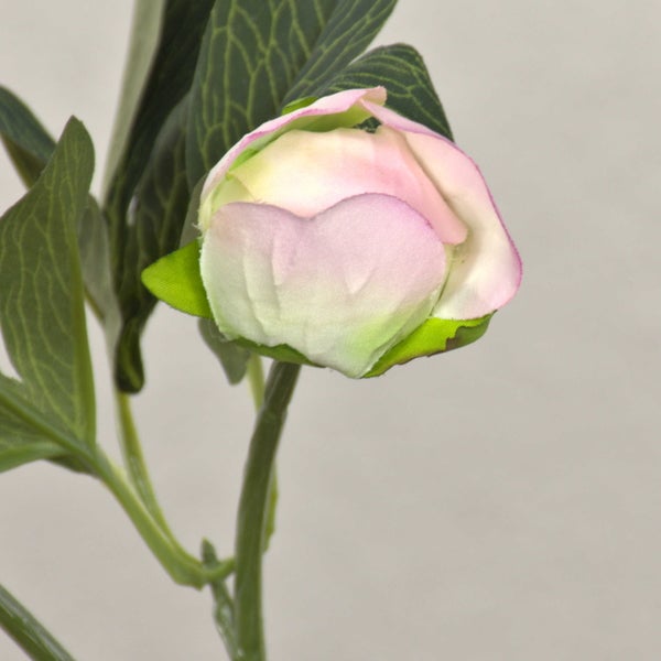 Künstliche pinke Blumenknospe mit grünen Blättern und Stiel.
