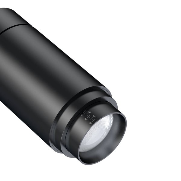 Runde Deckenleuchte mit Stoffschirm im Sternendesign in einem hellen, modern eingerichteten Zimmer.