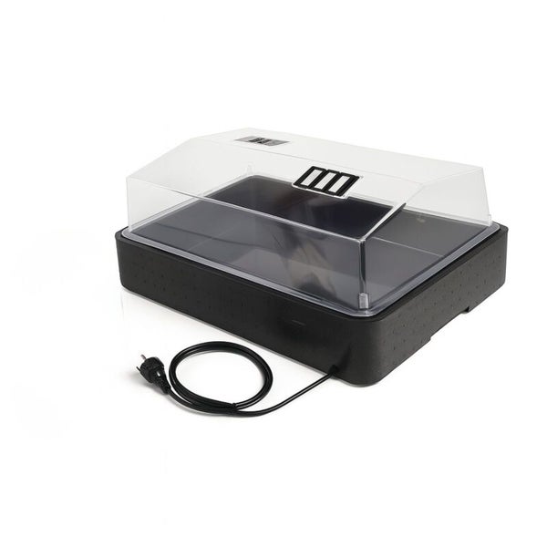 Beheizbares Zimmergewächshaus mit transparentem Deckel, Belüftungsschlitzen und schwarzer Basis inklusive Netzkabel.