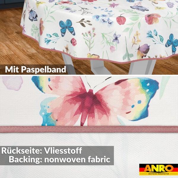 Tischdecke mit Schmetterlings- und Blumenmuster, eingefasst mit Paspelband und einer Rückseite aus Vliesstoff. ANRO Logo.