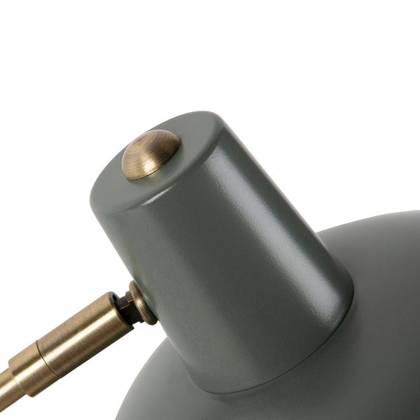 Detailaufnahme einer grauen Lampe mit goldenen Akzenten