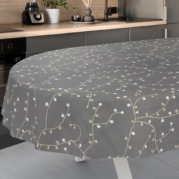 Tischdecke mit Rankenmuster und weißen Punkten in einer modernen Küche.