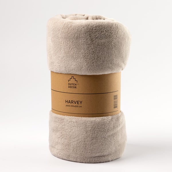 Gerollte Kuscheldecke mit Banderole der Marke Dutch Decor, Modell Harvey, Größe 150x200 cm