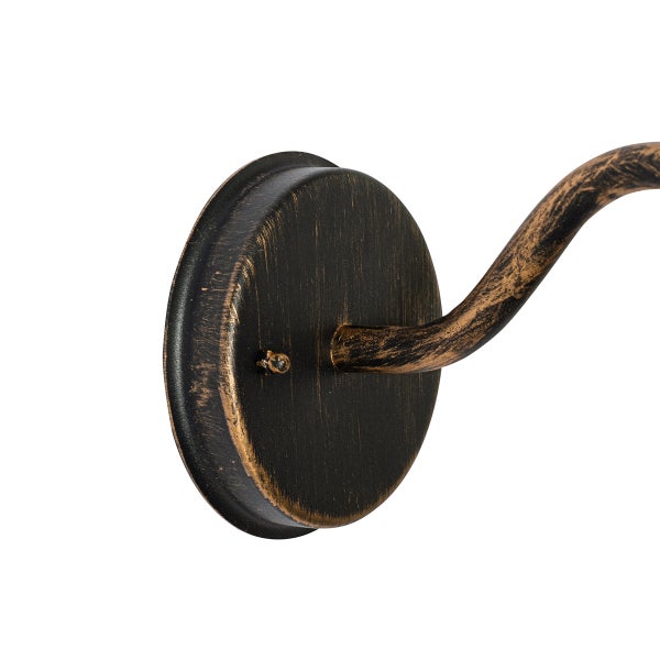 Detailansicht der Wandhalterung einer Leuchte aus Metall in Schwarz-Gold Antik-Optik.