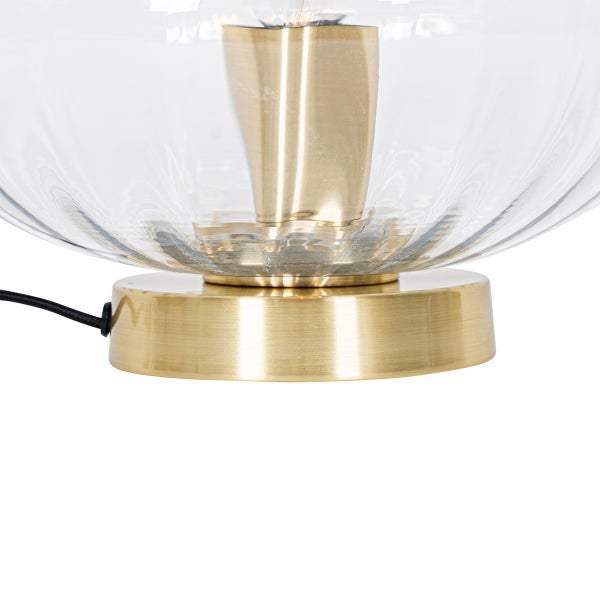 Nahaufnahme einer Tischleuchte mit einem Lampenschirm aus Glas und einem Sockel aus Metall