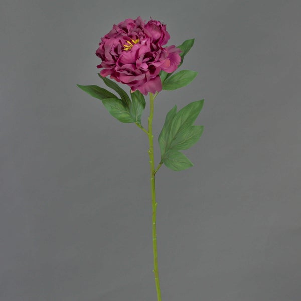 Künstliche Pfingstrose in Dunkelrosa mit grünem Stiel und Blättern.