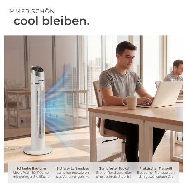 Turmventilator mit schlankem Design in einem hellen Büro, Person arbeitet am Laptop, stabiler Sockel und praktischer Tragegriff.