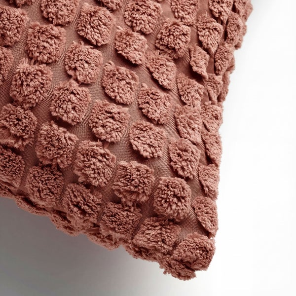 Dekokissen mit Noppenstruktur