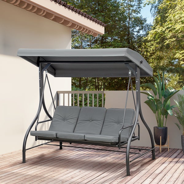 Moderne 3-Sitzer Hollywoodschaukel mit grauem Dach und passenden Polstern auf einer hellen Holzterrasse neben grünen Pflanzen.