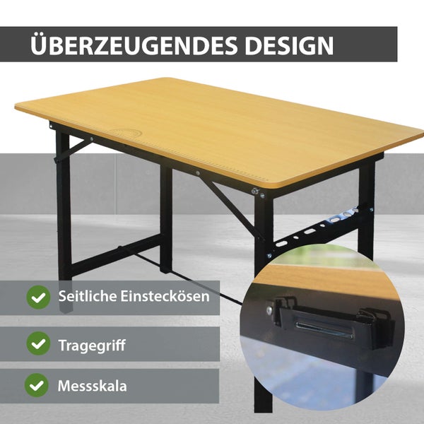 Klappbarer Mehrzwecktisch mit Arbeitsplatte in Holzoptik, schwarzem Metallgestell, integrierter Messskala und seitlichem Tragegriff.
