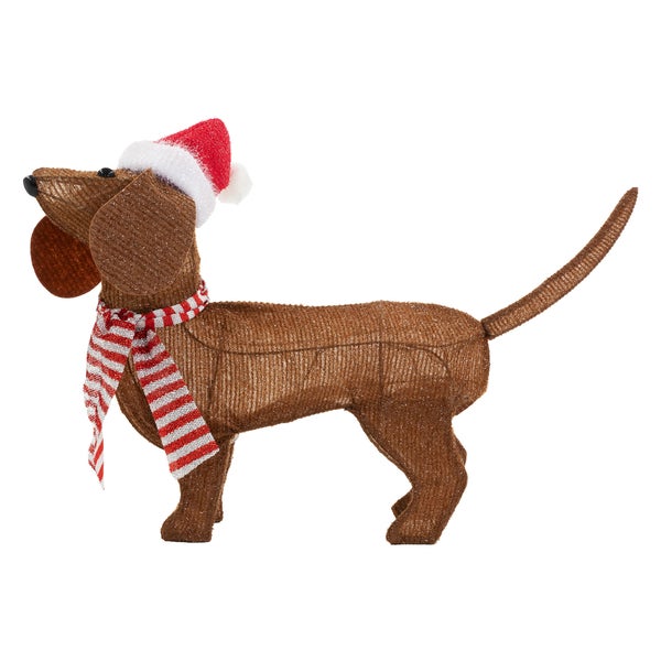 Dekorative Dackel-Figur mit Weihnachtsmütze und Schal als Weihnachtsdekoration.