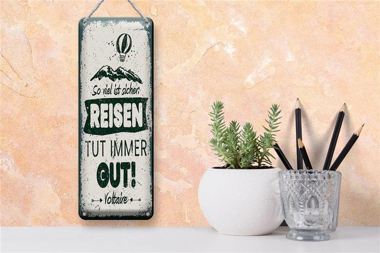 Blechschild Spruch Voltaire Reisen tut immer gut 10x27cm Dekoration