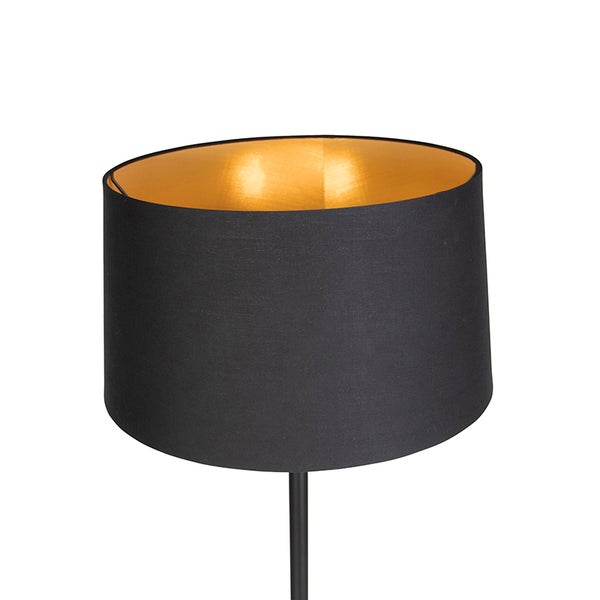 Zylindrischer Lampenschirm aus schwarzem Textil mit goldfarbener Innenseite.
