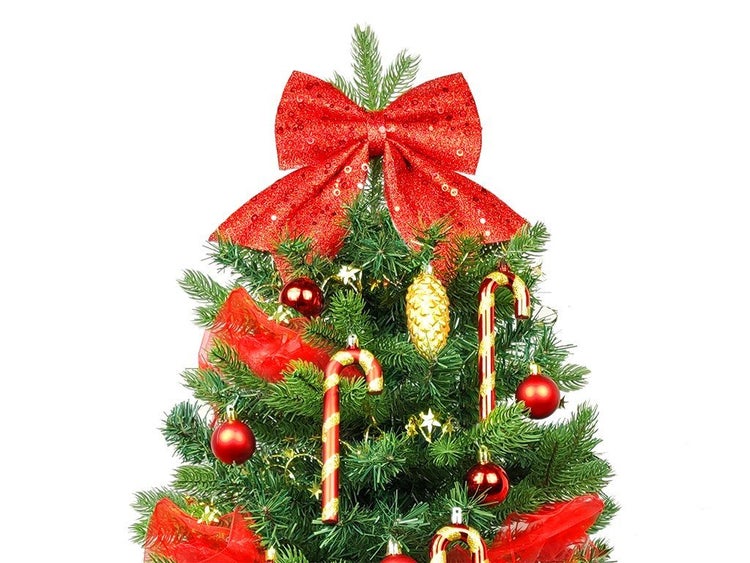 Weihnachtsbaumspitze mit einer glitzernden Schleife zur Dekoration eines Weihnachtsbaums