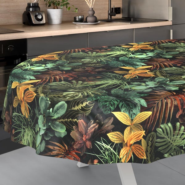 Runde Tischdecke mit tropischem Blättermuster in einer modernen Küche.